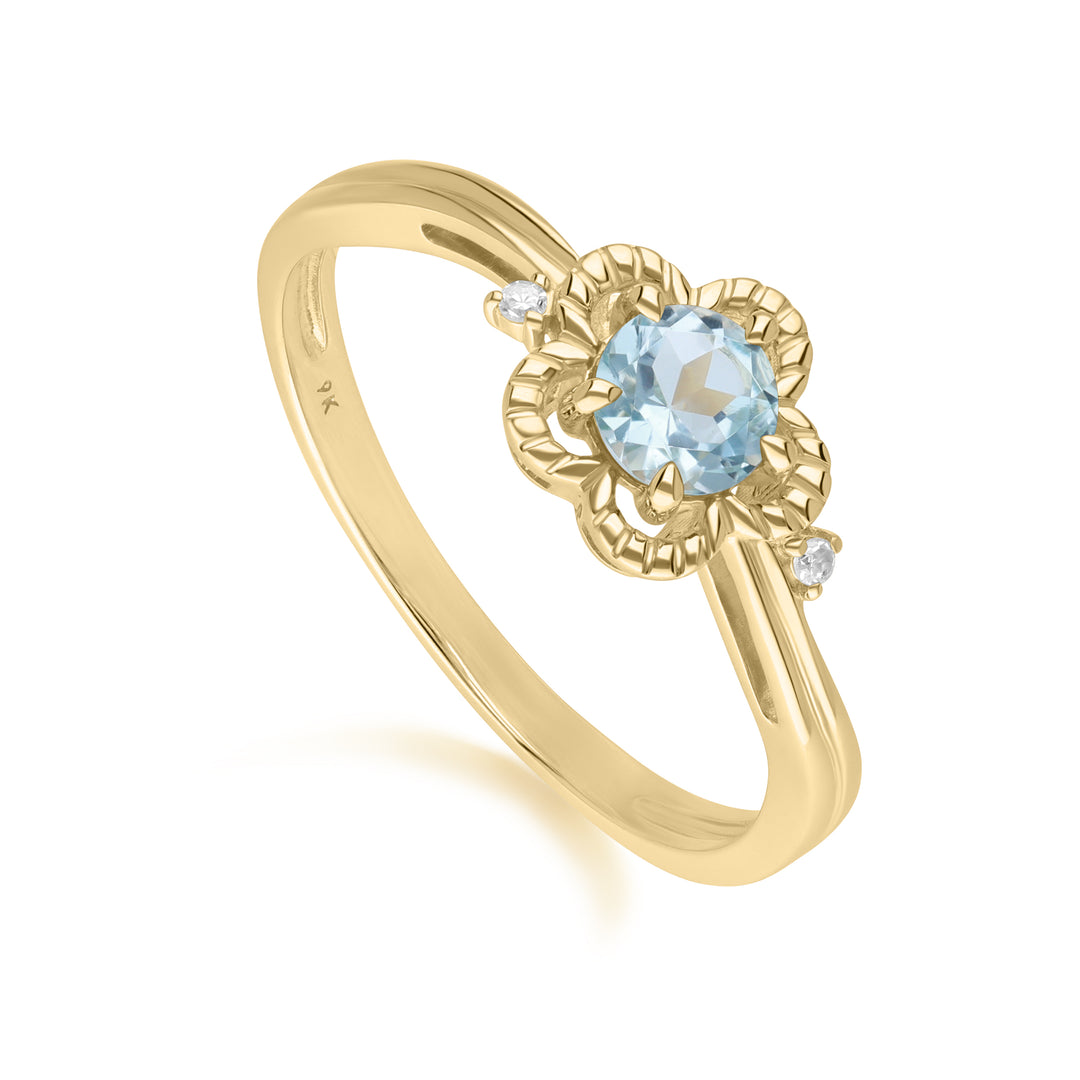 Runder Ring mit blauem Topas und Diamanten in 9 kt Gelbgold mit Blumenmuster