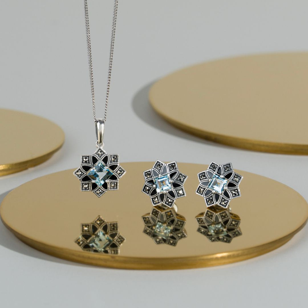 Art-Deco-inspirierte Stern-Ohrstecker mit blauem Topas und Markasit