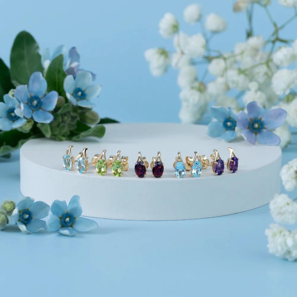 Classic Oval Sky Blue Topaz Stud Earrings in 9ct Yellow Gold 7x5mm