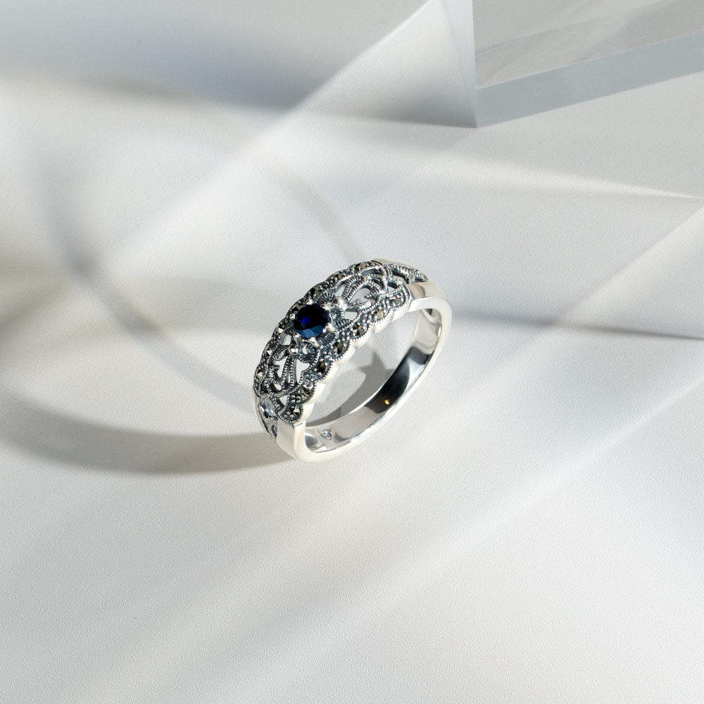 Art Nouveau Style Round Sapphire & Marcasite Floral Band Ring in Sterling Silver flatlay