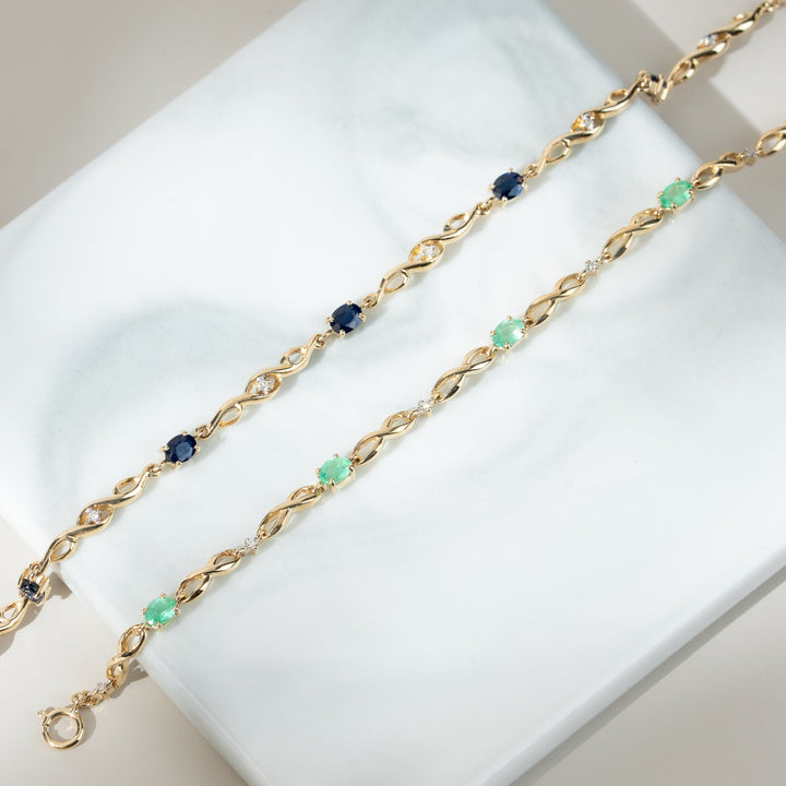 Infinity Luxe Tennisarmband mit Smaragd und Diamanten in 9 Karat Gold