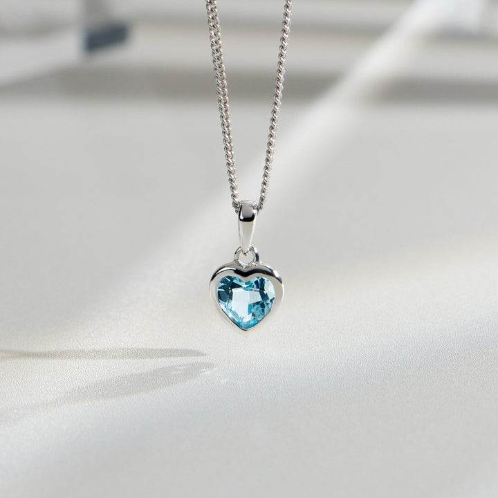 Essential Heart Shaped Blue Topaz Pendant in 925 Sterling Silver flatlay