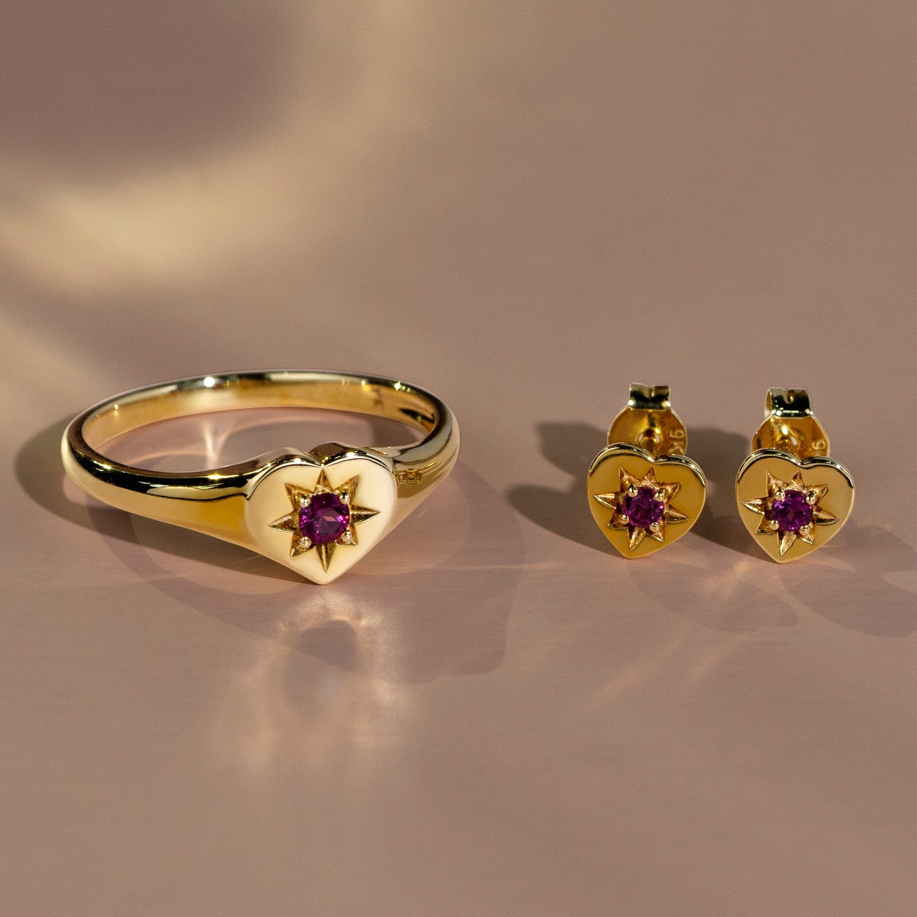 135E1820059 ECFEW™ 'The Liberator' Amethyst Heart Stud Earrings in 9ct Yellow Gold On Model